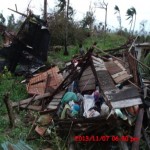 The remains of a house in the neighborhood of one of the White Fields churches following a typhoon.