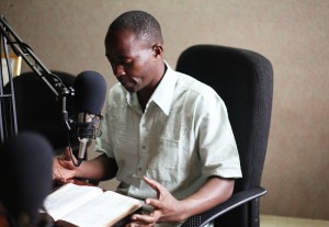 Teaching on a radio broadcast in Africa. 