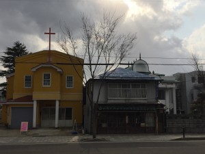 The church building of Pastor Saito stands between two Buddhist Temples providing a genuine lighthouse for hope and peace with God.