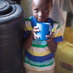 A child receives a cup of fresh water