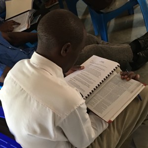 Dedicated student fills his lap to study the Bible